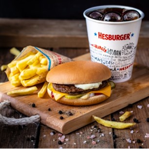 Hesburger food set that includes cheeseburger, drink coca-cola and french fries.