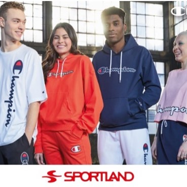 Four teenagers in Sportland clothing stand together and smile.